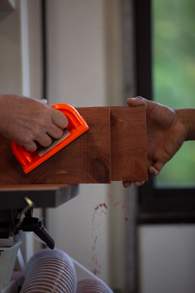 Cruz Chavez assists students as they learn the ins-and-outs of Sawdust Studios’ different woodworking machines